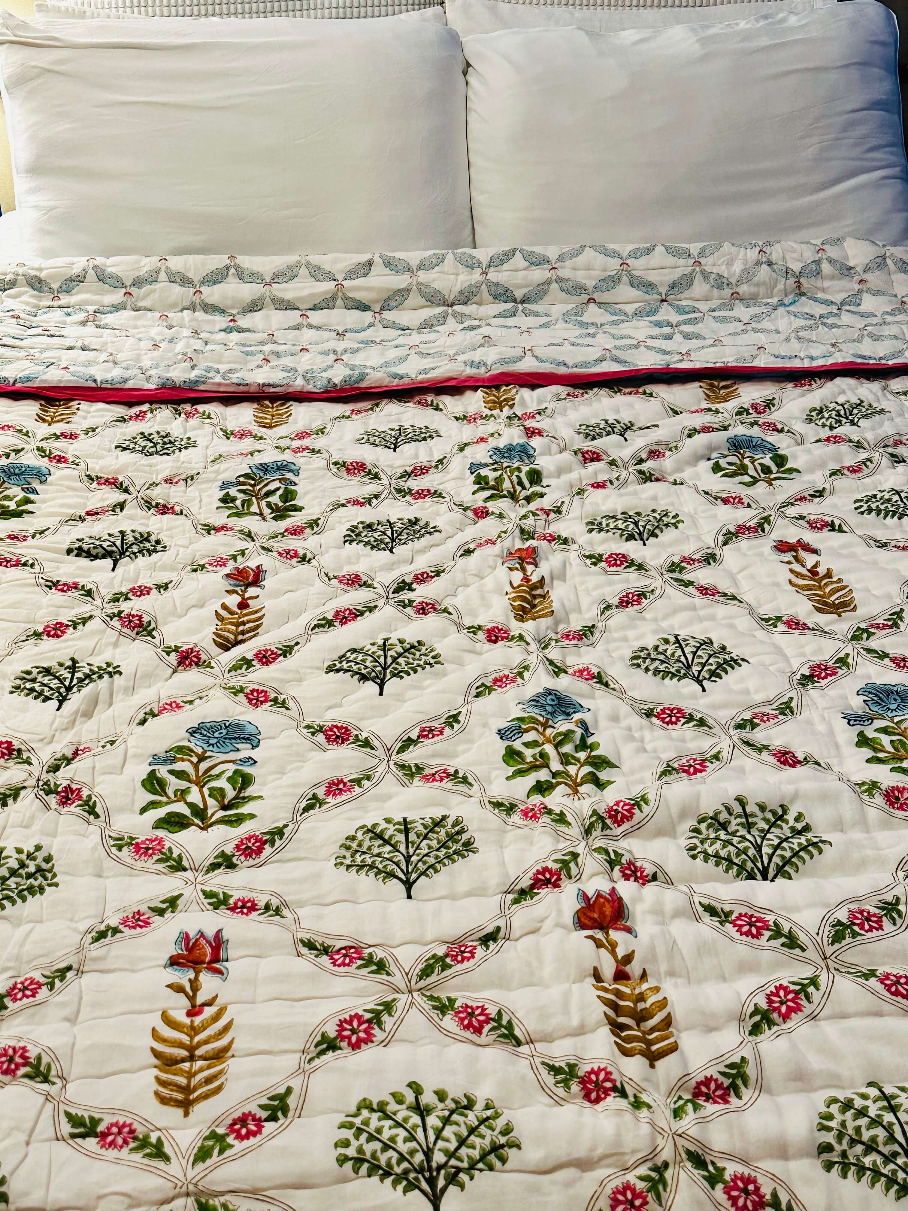 Front view of the Blush Vine Reverie quilt featuring soft blush tones