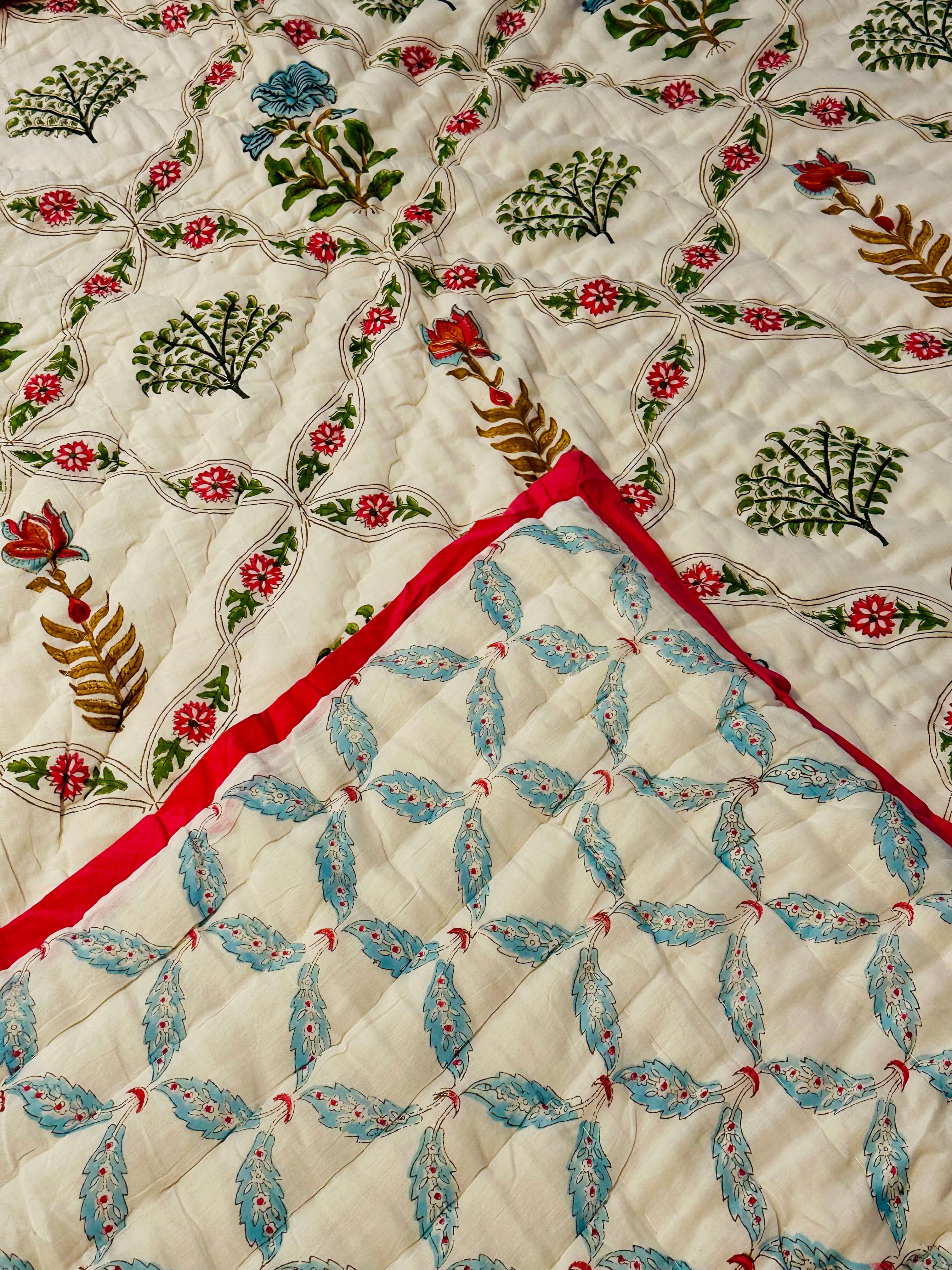 Blush Vine Reverie quilt in soft pink, front view