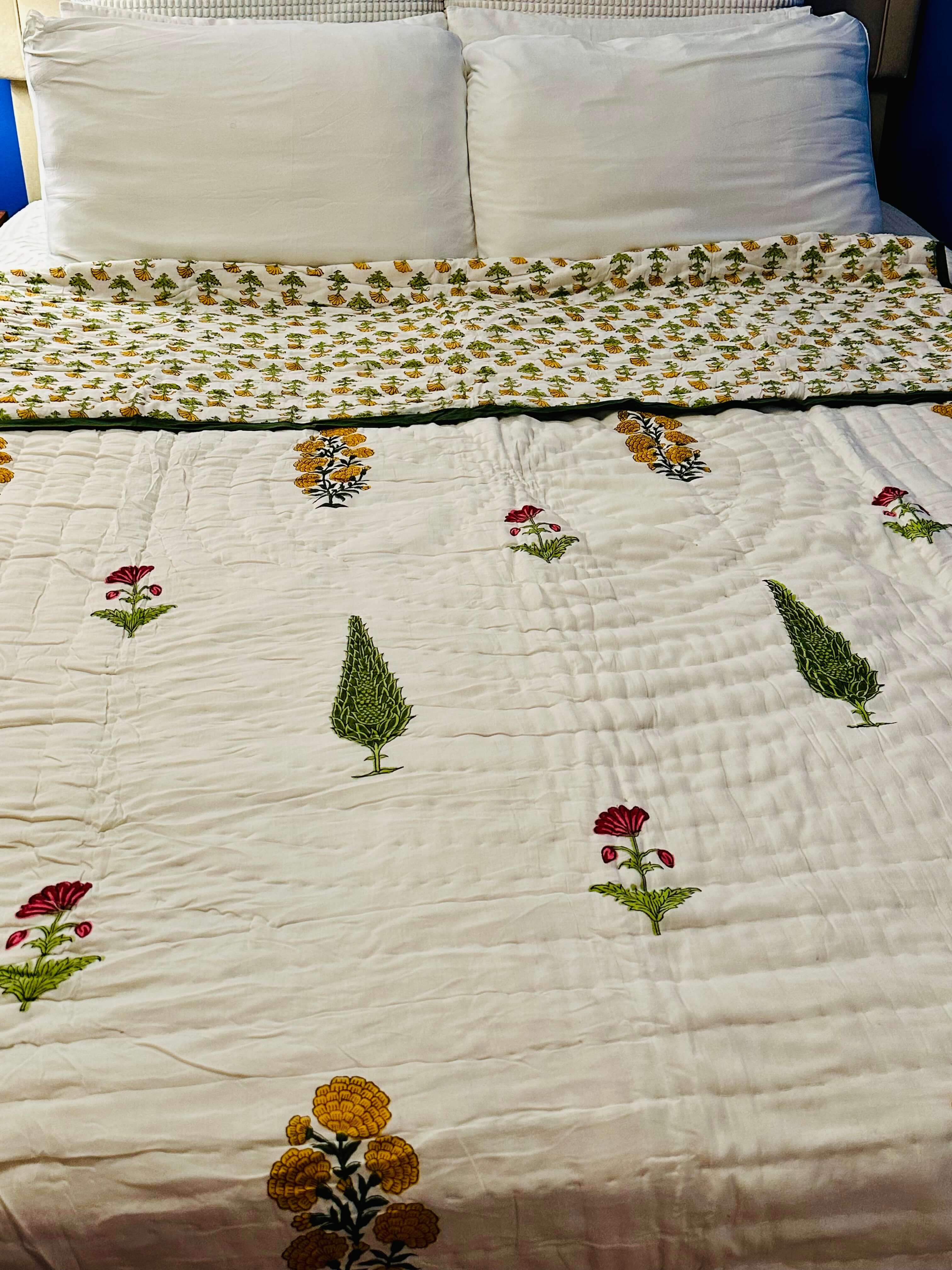 Marigold Grove quilt with floral gold and green design, front