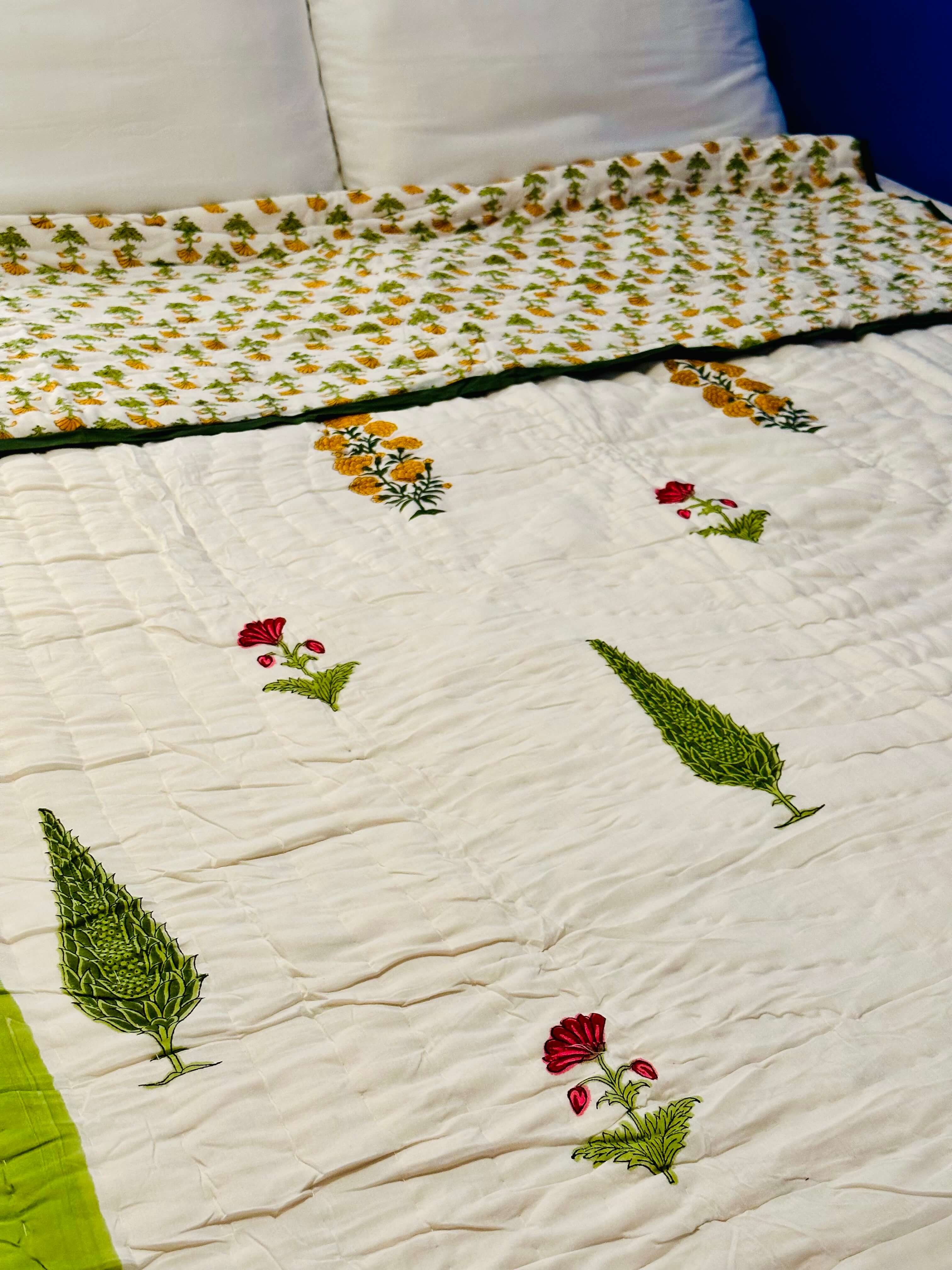 Marigold Grove quilt with floral gold and green design, front