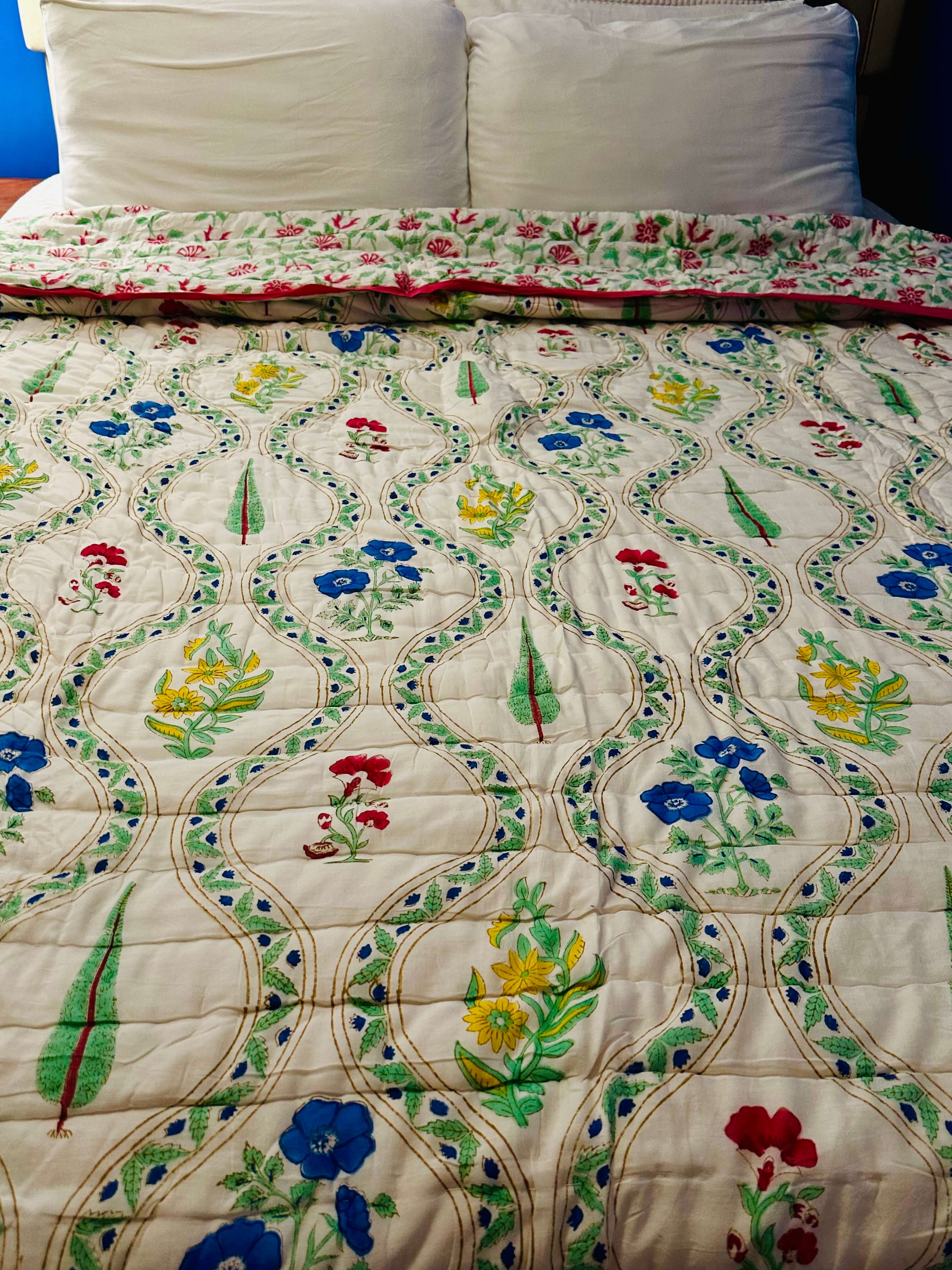 Petals Pine quilt with floral pattern, front full display view.
