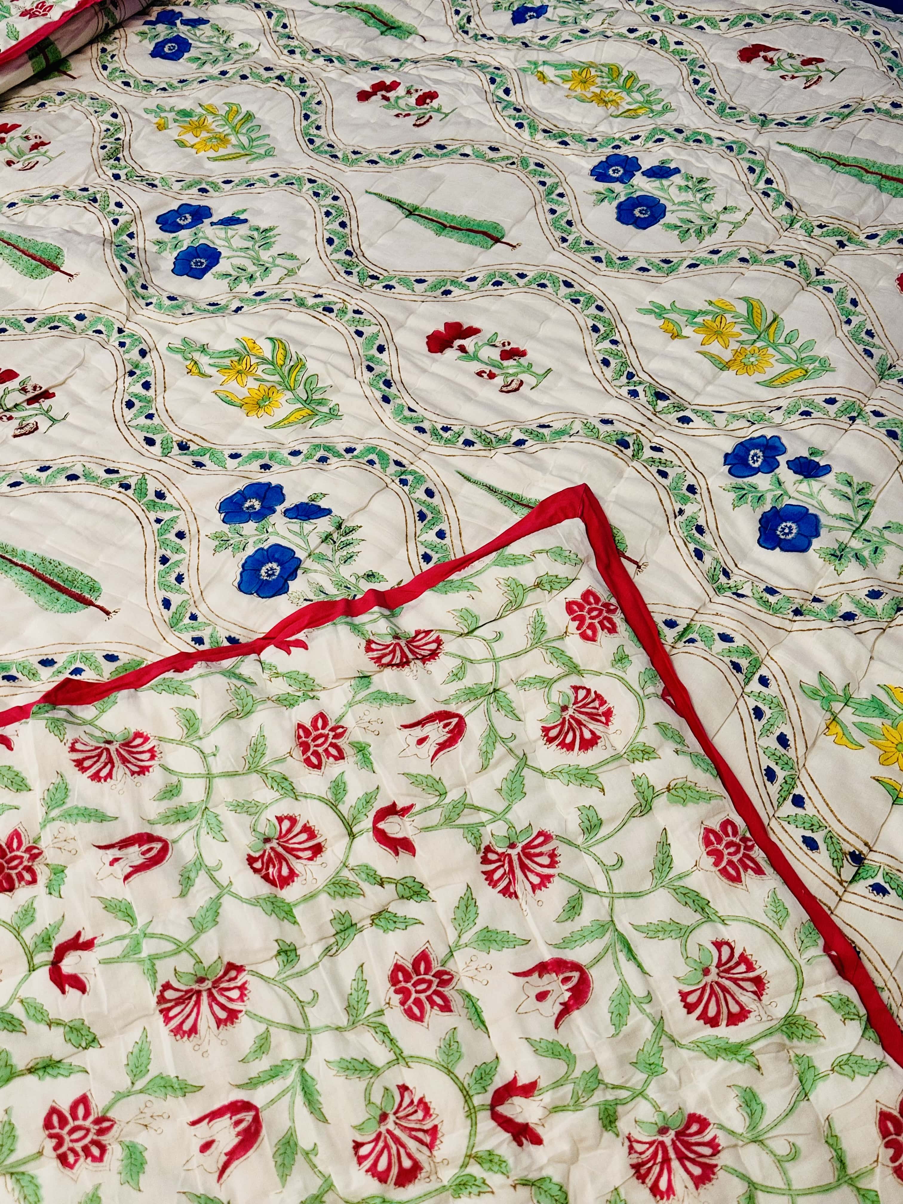 Reverse side of Petals Pine quilt with delicate floral pattern