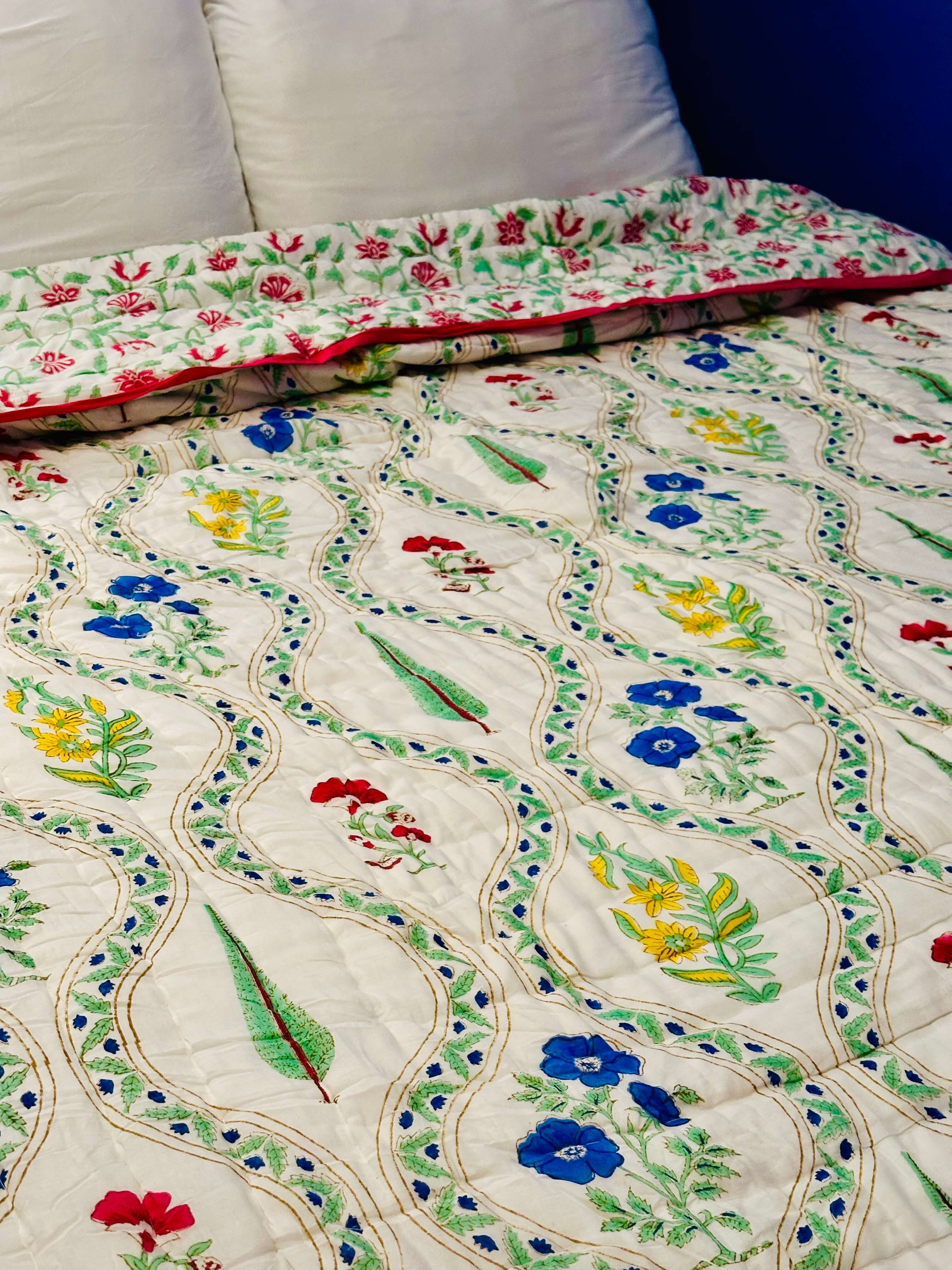 Side view of Petals Pine quilt showing layered fabric and stitching