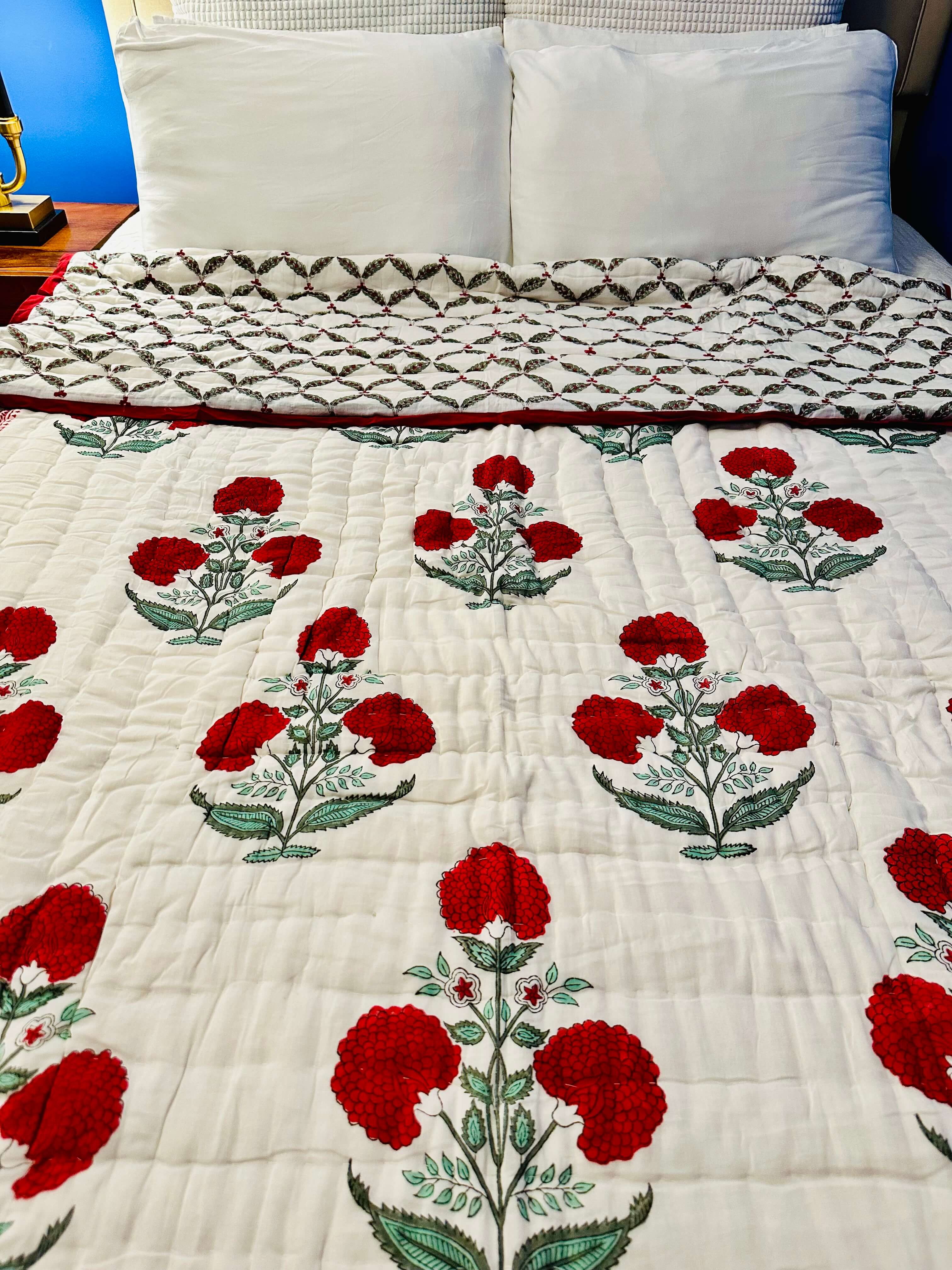 Front view of Red Dahlia quilt featuring bold floral design