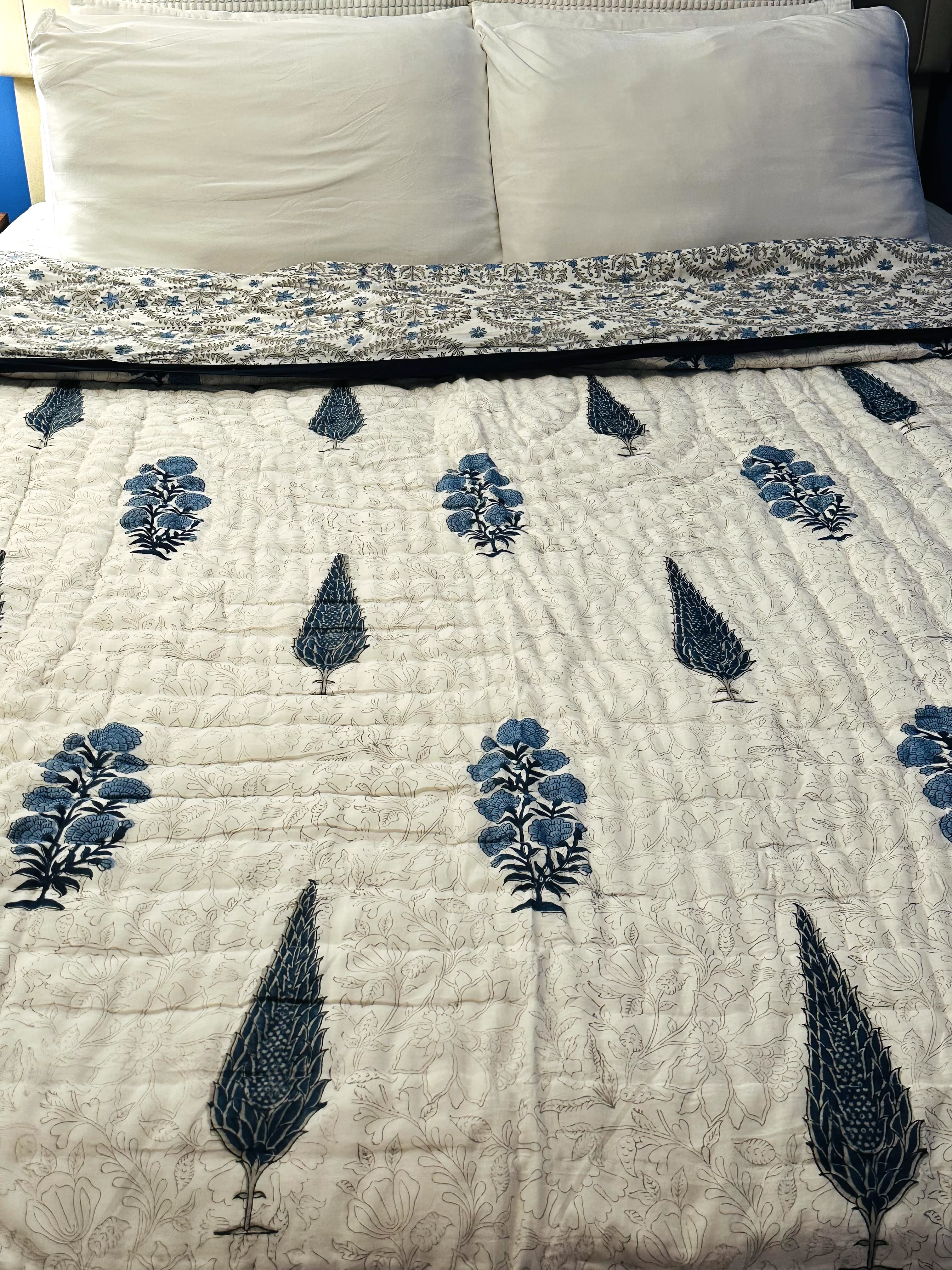 Shadow Bloom quilt with dark floral pattern, front display