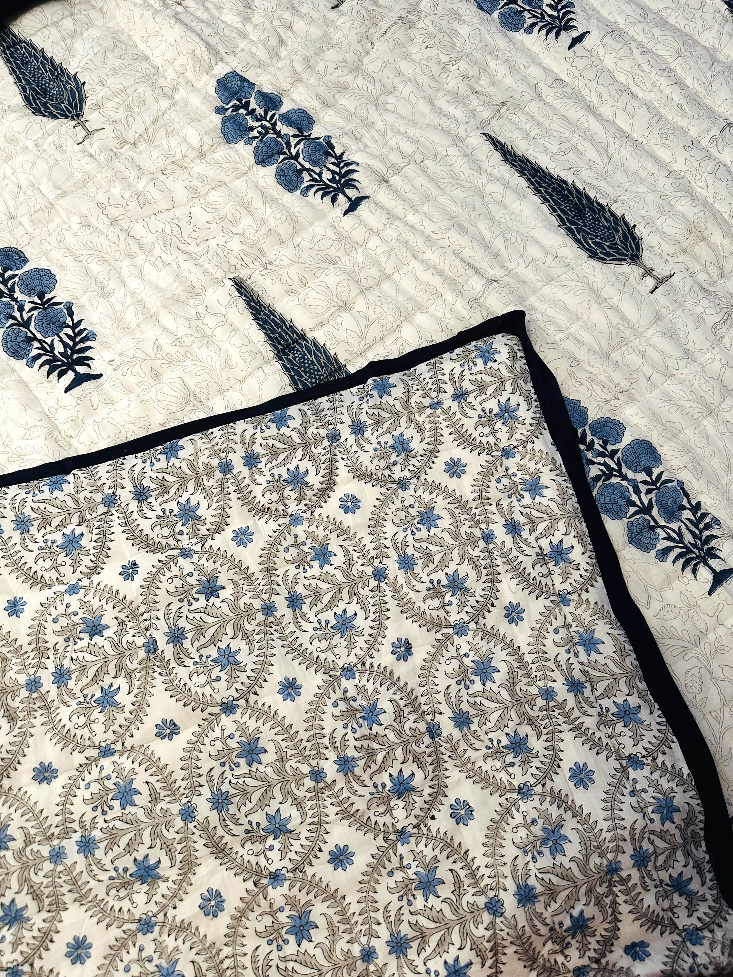 Reverse side of Shadow Bloom quilt with soft pattern detail