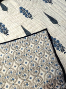 Reverse side of Shadow Bloom quilt with soft pattern detail